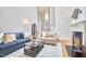 Bright living room with fireplace and staircase at 8605 Stanton Pl, Raleigh, NC 27615