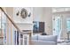 Cozy living room featuring a fireplace, decorative sconces, and access to outdoor space at 8605 Stanton Pl, Raleigh, NC 27615