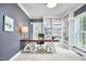 Spacious office with a modern desk, custom built-in shelves, plantation shutters, and neutral carpeting at 8605 Stanton Pl, Raleigh, NC 27615