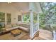 Inviting covered porch with comfortable seating overlooking a lush green yard at 8605 Stanton Pl, Raleigh, NC 27615