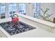 Island stovetop with modern gas burners and a red tea kettle, adding a pop of color to the kitchen at 8605 Stanton Pl, Raleigh, NC 27615