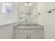 Bathroom vanity with granite countertop, modern fixtures, and ample storage space at 87 Browning Mill Dr, Wendell, NC 27591