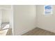Bedroom with hardwood floors, neutral walls, and natural light from a single window at 87 Browning Mill Dr, Wendell, NC 27591