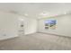 Inviting bedroom with neutral walls, carpet, and a view of the outdoors at 87 Browning Mill Dr, Wendell, NC 27591