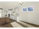 Bright kitchen features white cabinetry, granite countertops and stainless steel appliances, with natural light at 87 Browning Mill Dr, Wendell, NC 27591
