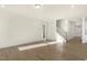 Spacious living room features hardwood floors and an open layout connecting to the staircase and entry at 87 Browning Mill Dr, Wendell, NC 27591