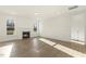 Bright living room boasts hardwood floors, a cozy fireplace and natural light from large windows at 87 Browning Mill Dr, Wendell, NC 27591
