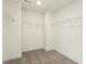 Simple walk-in closet with wire shelving providing efficient storage space at 87 Browning Mill Dr, Wendell, NC 27591
