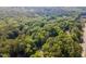Expansive aerial view of a wooded lot offering serenity and privacy in a peaceful setting at 8812 Valley Hill Ct, Apex, NC 27539