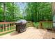 The back deck provides an ideal space for relaxing and enjoying the surrounding nature at 8812 Valley Hill Ct, Apex, NC 27539