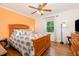 Relaxing bedroom with a ceiling fan, neutral-toned walls, and hardwood floors at 8812 Valley Hill Ct, Apex, NC 27539