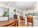 Modern kitchen featuring a breakfast bar, stainless steel appliances, hardwood floors, and ample counter space at 8812 Valley Hill Ct, Apex, NC 27539