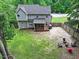 Aerial view of home showing backyard with patio, play area, and surrounding landscape at 9300 Glendora Ct, Garner, NC 27529