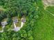 Aerial view showcases two homes with a lush green lawn and mature trees at 9300 Glendora Ct, Garner, NC 27529