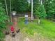 Aerial of backyard with playground, seating, shed, and ample green space at 9300 Glendora Ct, Garner, NC 27529