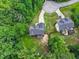 Aerial view of a home with a well-maintained yard, surrounded by mature trees for added privacy at 9300 Glendora Ct, Garner, NC 27529