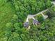 Aerial view of two homes featuring beautiful green lawns and mature trees; set among a natural and peaceful surrounding at 9300 Glendora Ct, Garner, NC 27529