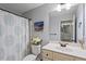 Bathroom featuring vanity sink, flower accents, and shower at 9300 Glendora Ct, Garner, NC 27529