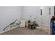 room with chair, play table, carpeted floor, and dinosaur-themed wallpaper at 9300 Glendora Ct, Garner, NC 27529