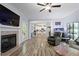 Living room with a fireplace, a kitchen in background, an open concept living space at 9300 Glendora Ct, Garner, NC 27529
