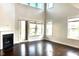 Bright living room boasts hardwood floors, fireplace, and ample natural light from the many windows at 931 Haybeck Ln, Apex, NC 27523