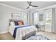 Cozy bedroom with a large bed, desk, and a ceiling fan for added comfort at 941 W Club Blvd, Durham, NC 27701