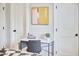Desk in bedroom with office chair, modern art and closet storage at 941 W Club Blvd, Durham, NC 27701
