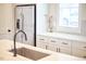 Bright kitchen featuring modern white cabinetry, stainless steel appliances, and ample counter space at 941 W Club Blvd, Durham, NC 27701