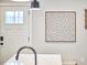 Stylish kitchen decor includes an intricate wall art piece near the entry door at 941 W Club Blvd, Durham, NC 27701