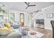 Open-concept living room features a staircase, modern furnishings, and hardwood floors at 941 W Club Blvd, Durham, NC 27701