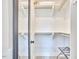 Well-organized walk-in closet with ample shelving and storage space for clothes and accessories at 941 W Club Blvd, Durham, NC 27701
