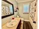Bathroom featuring a shower/tub combo with white and grey patterned shower curtain at 1000 Roundtable Ct, Knightdale, NC 27545