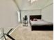 Bedroom featuring light carpet, one window, bed, and an inversion table at 1000 Roundtable Ct, Knightdale, NC 27545
