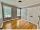 Bedroom with hardwood floors, two windows, and double closet at 1000 Roundtable Ct, Knightdale, NC 27545