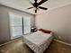 Neutral bedroom with large window and ceiling fan at 1000 Roundtable Ct, Knightdale, NC 27545