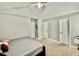 Bedroom featuring a ceiling fan, carpeted floors, and two doors at 1000 Roundtable Ct, Knightdale, NC 27545