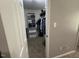 Walk-in closet with carpet, built-in shelving, and hanging racks at 1000 Roundtable Ct, Knightdale, NC 27545