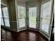 Bay window floods this sunroom with natural light and features wood floor at 1000 Roundtable Ct, Knightdale, NC 27545