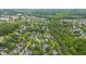 A beautiful aerial view of a quiet, tree-lined neighborhood with traditional homes at 102 Newell St, Chapel Hill, NC 27516