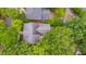 An aerial view of a home with mature trees in a well-kept neighborhood at 102 Newell St, Chapel Hill, NC 27516