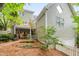 The back of this house features a covered patio area and a fenced backyard at 102 Newell St, Chapel Hill, NC 27516