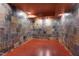 Finished basement with colorful slate tile walls and sealed wood floors at 102 Newell St, Chapel Hill, NC 27516