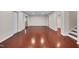 Expansive basement area with hardwood floors, recessed lighting, and multiple access points at 102 Newell St, Chapel Hill, NC 27516