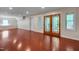 Finished basement area with a door to outside and a set of French doors to a patio at 102 Newell St, Chapel Hill, NC 27516