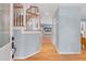 Inviting foyer featuring hardwood floors, a staircase with wooden banisters, and light blue walls, creating a bright entrance at 102 Newell St, Chapel Hill, NC 27516