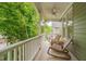 Cozy front porch featuring comfortable chairs and scenic views, ideal for enjoying outdoor relaxation and entertaining guests at 102 Newell St, Chapel Hill, NC 27516