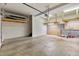 Unfinished garage area with concrete floors and work storage shelving at 102 Newell St, Chapel Hill, NC 27516