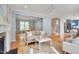 Inviting living room featuring a fireplace, hardwood floors, and neutral-toned furniture at 102 Newell St, Chapel Hill, NC 27516