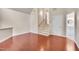 Spacious living room features wood floors, a staircase, and an open layout, perfect for entertaining at 102 Newell St, Chapel Hill, NC 27516