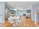 Open-concept space featuring a dining area, living room, hardwood floors, and lots of natural light at 102 Newell St, Chapel Hill, NC 27516